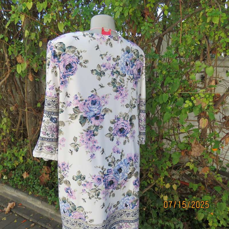 Tasteful pink-blue floral print on white background long stretch polyester top. Size 44