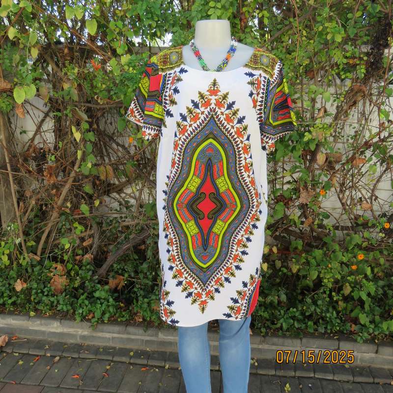 Ethnic long white polycotton short sleeve top with colourful striking print. Size 34.