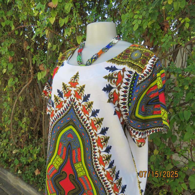 Ethnic long white polycotton short sleeve top with colourful striking print. Size 34.