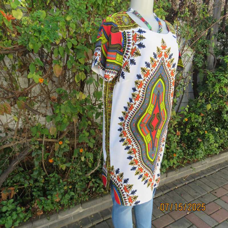 Ethnic long white polycotton short sleeve top with colourful striking print. Size 34.