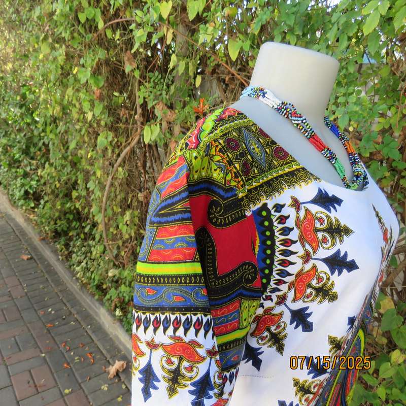 Ethnic long white polycotton short sleeve top with colourful striking print. Size 34.