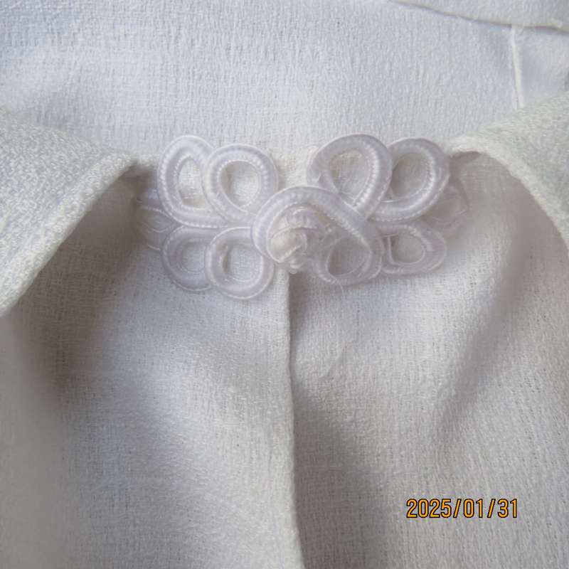 Textured polyester white long cuffed sleeve wide cut open jacket. One button-loop closure. Size 50.