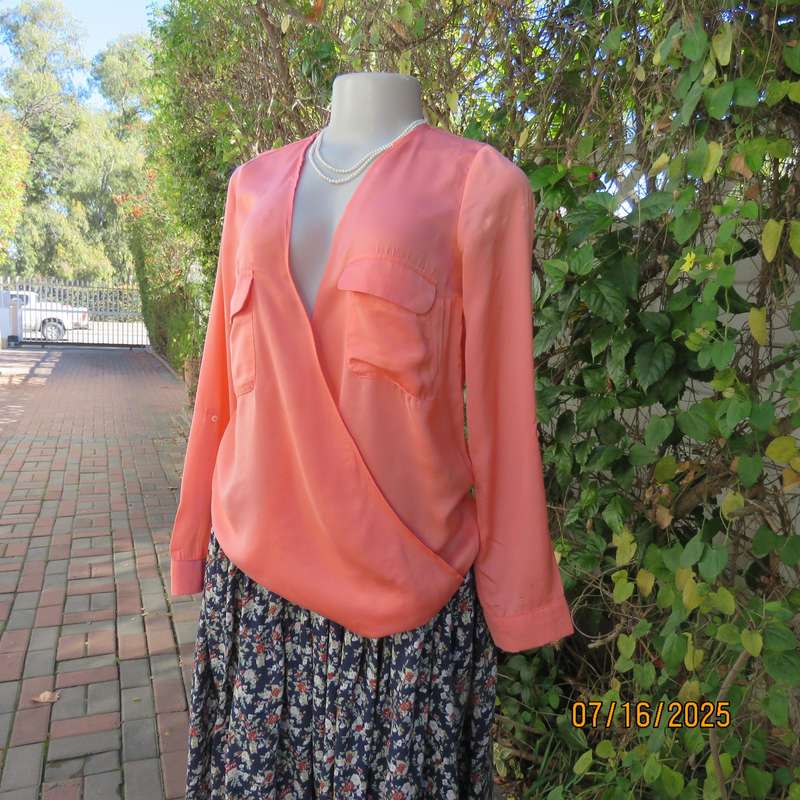 TRAFALUC  ZARA coral colour long sleeve cross over luxury polyester top. Size 35
