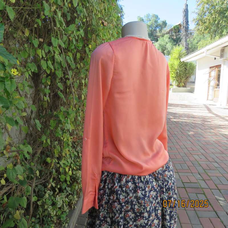 TRAFALUC  ZARA coral colour long sleeve cross over luxury polyester top. Size 35