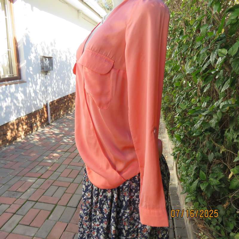 TRAFALUC  ZARA coral colour long sleeve cross over luxury polyester top. Size 35