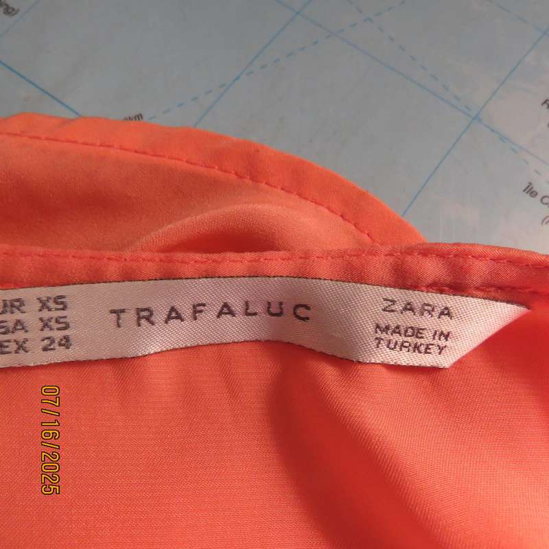 TRAFALUC  ZARA coral colour long sleeve cross over luxury polyester top. Size 35