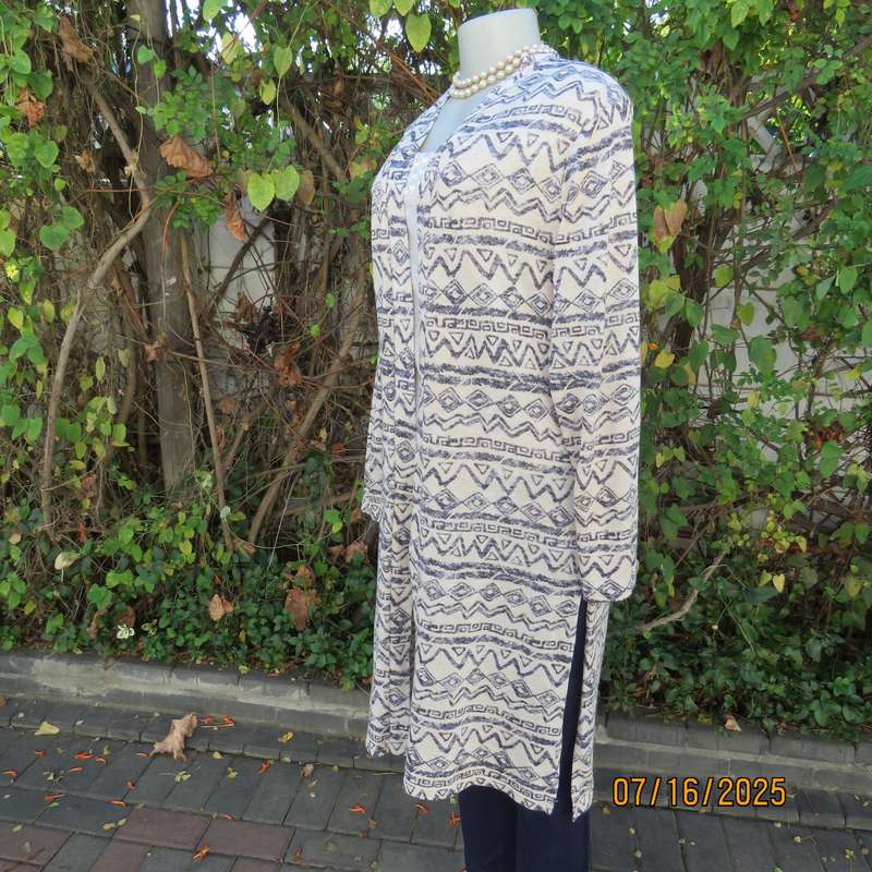 Calf length rich cream with horizontal graphic pattern stretch polyester coat. Size 38