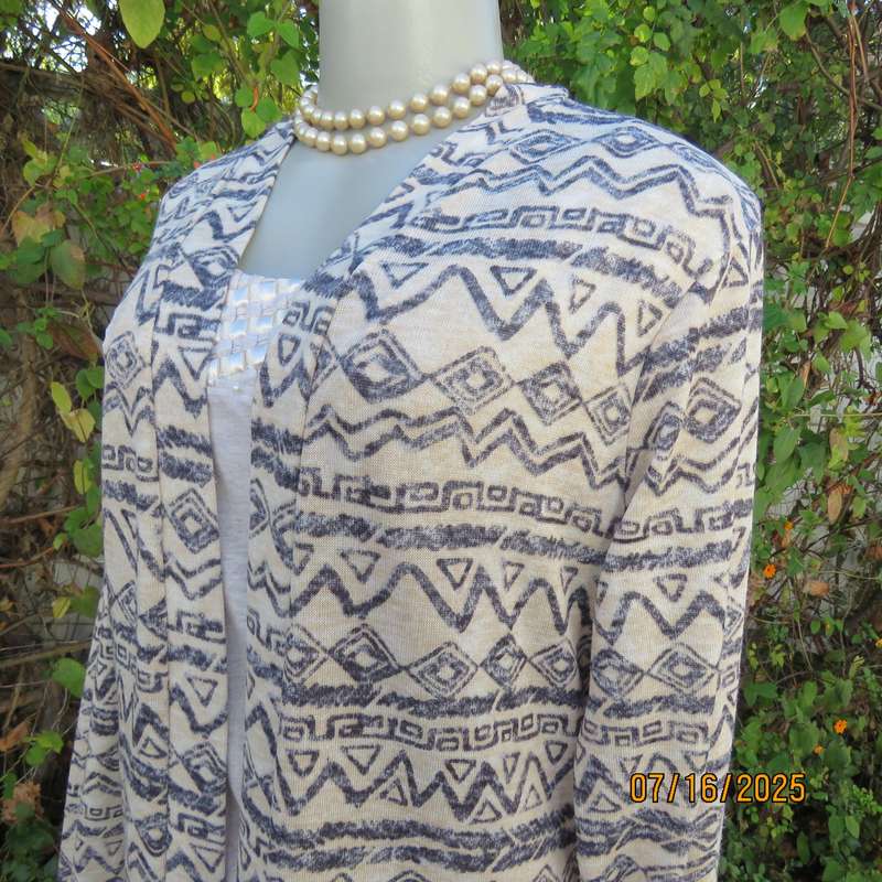 Calf length rich cream with horizontal graphic pattern stretch polyester coat. Size 38