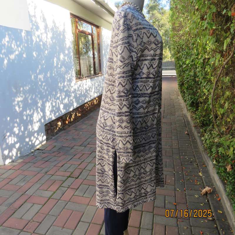 Calf length rich cream with horizontal graphic pattern stretch polyester coat. Size 38