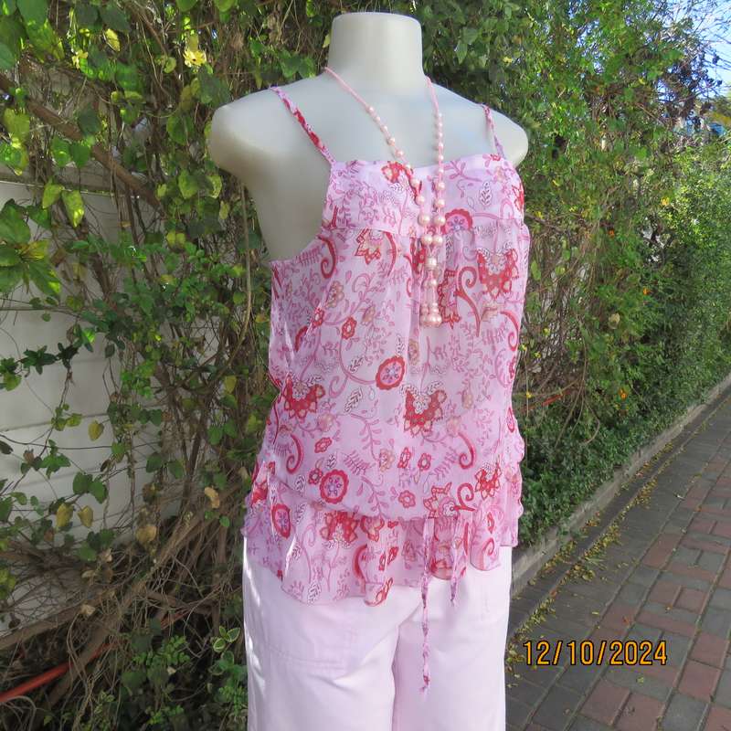 Chic slightly creased polyester pink top/red patterns. Size 34. Peplum frill.Drawstring waist.As new