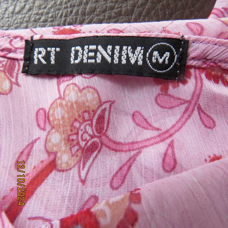 Chic slightly creased polyester pink top/red patterns. Size 34. Peplum frill.Drawstring waist.As new