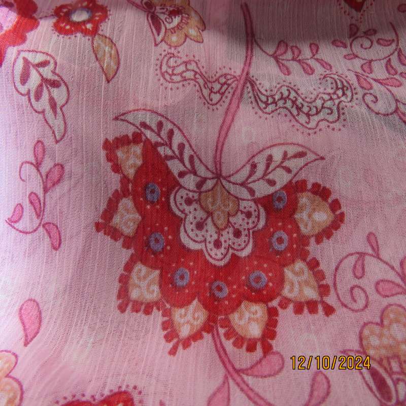 Chic slightly creased polyester pink top/red patterns. Size 34. Peplum frill.Drawstring waist.As new