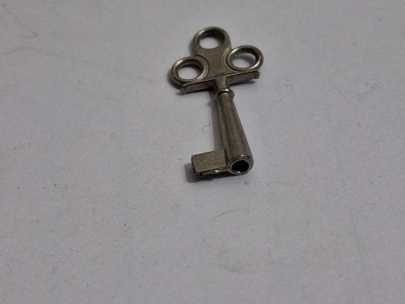 Small key, possibly for small clock or music box