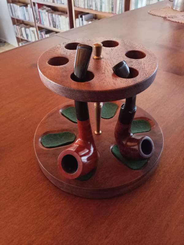 Pipe stand and two smoking pipes