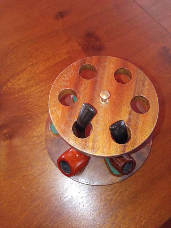 Pipe stand and two smoking pipes