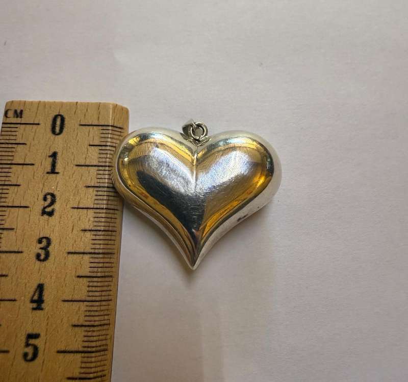 Sterling silver hollow heart pendant