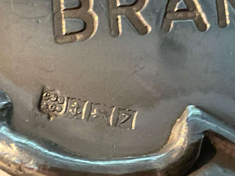 A sterling silver decanter label marked Brandy