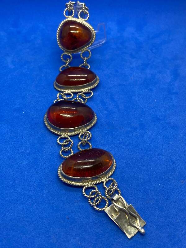 Silver bracelet with large amber stones