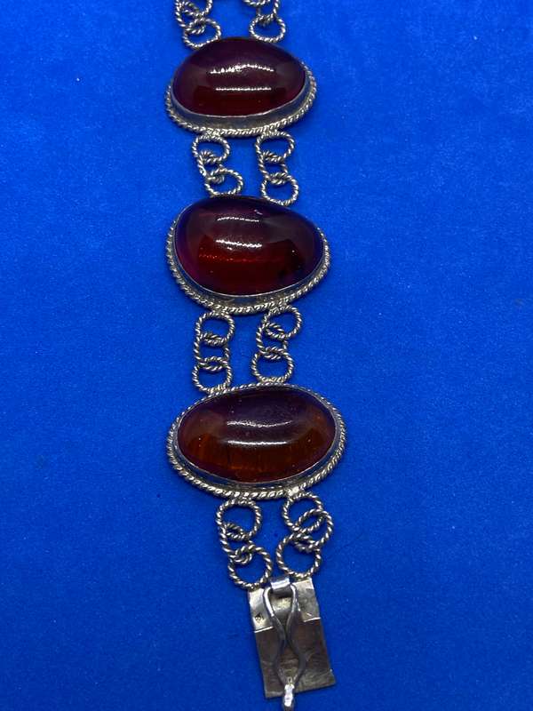 Silver bracelet with large amber stones