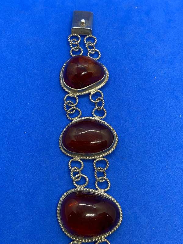 Silver bracelet with large amber stones
