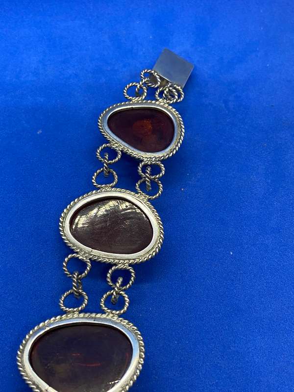 Silver bracelet with large amber stones