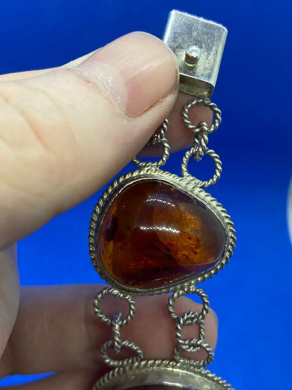 Silver bracelet with large amber stones