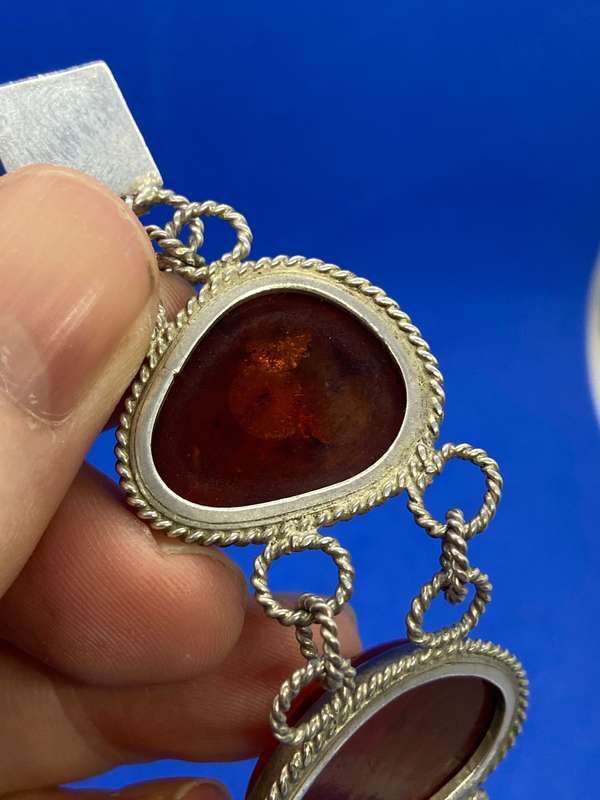 Silver bracelet with large amber stones