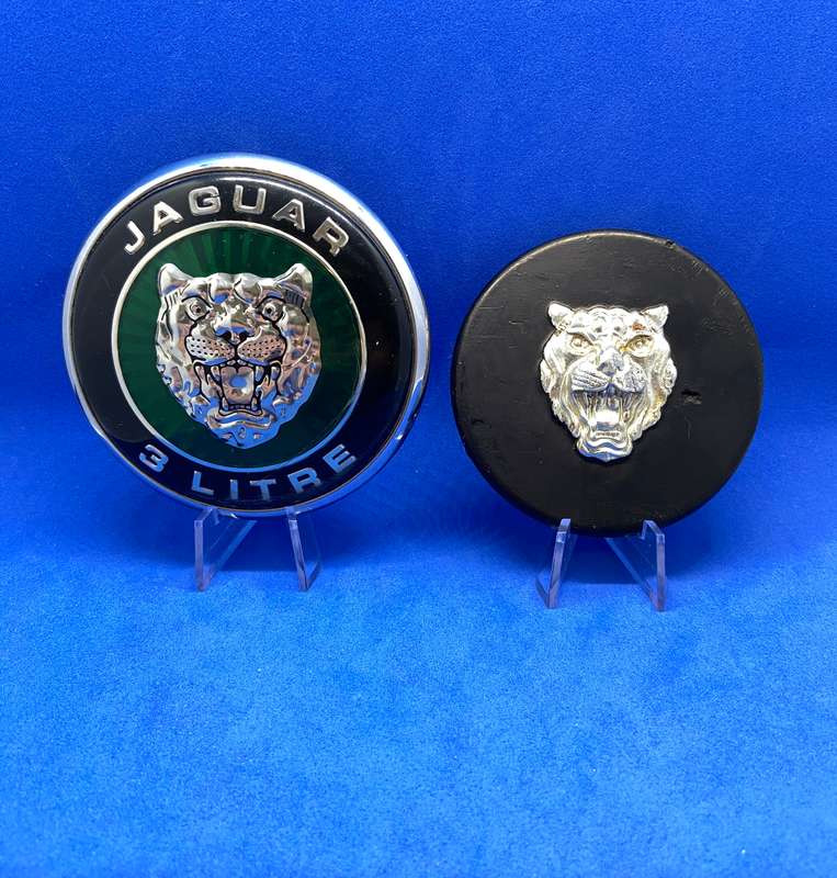 TWO JAGUAR BADGES