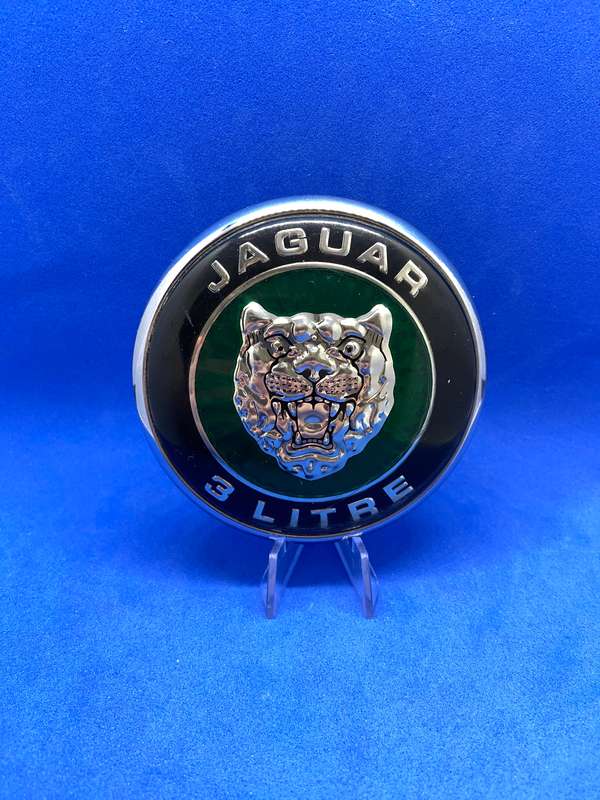 TWO JAGUAR BADGES