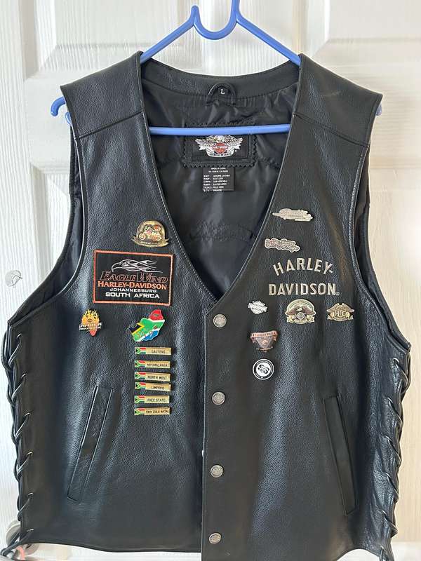 Harley-Davidson leather vest featuring multiple patches and pins  Like new | Genuine Harley Davidson