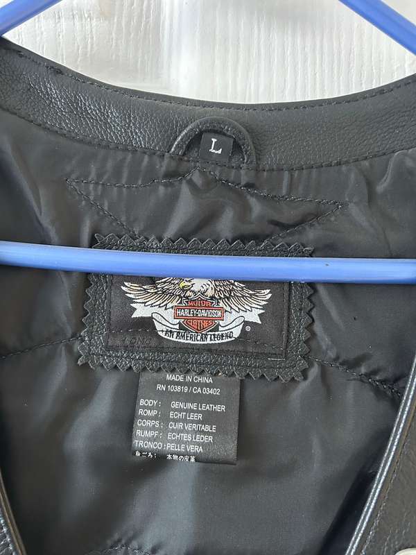 Harley-Davidson leather vest featuring multiple patches and pins  Like new | Genuine Harley Davidson