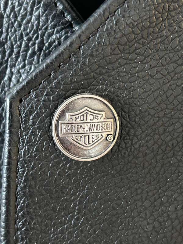 Harley-Davidson leather vest featuring multiple patches and pins  Like new | Genuine Harley Davidson