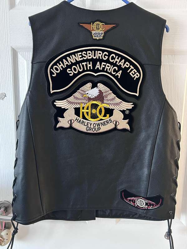 Harley-Davidson leather vest featuring multiple patches and pins  Like new | Genuine Harley Davidson