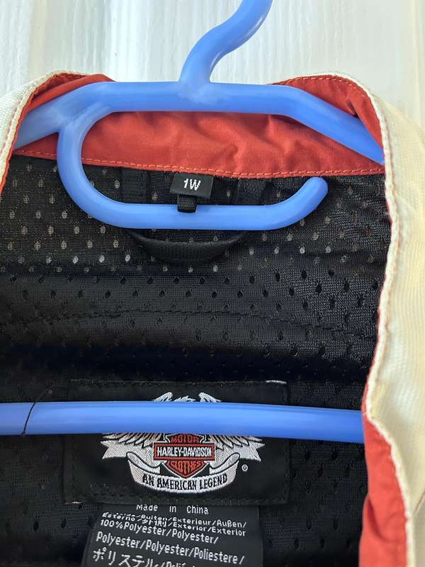 Harley-Davidson motorcycle jacket with a bold design in white, black, and red accents.