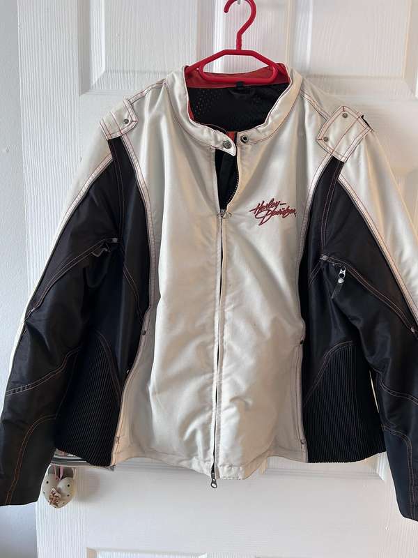 HarleyDavidson motorcycle jacket features a striking white body with black sleeves and red stitching