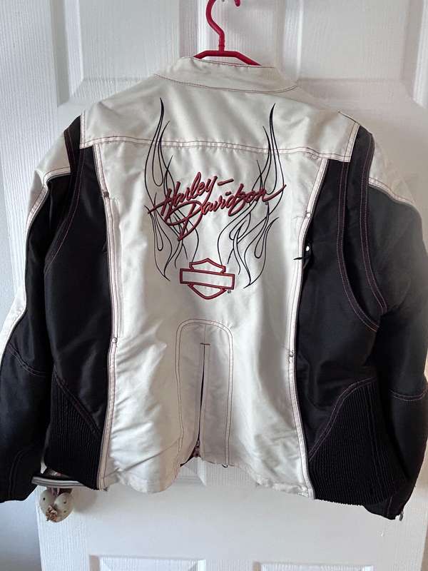 HarleyDavidson motorcycle jacket features a striking white body with black sleeves and red stitching