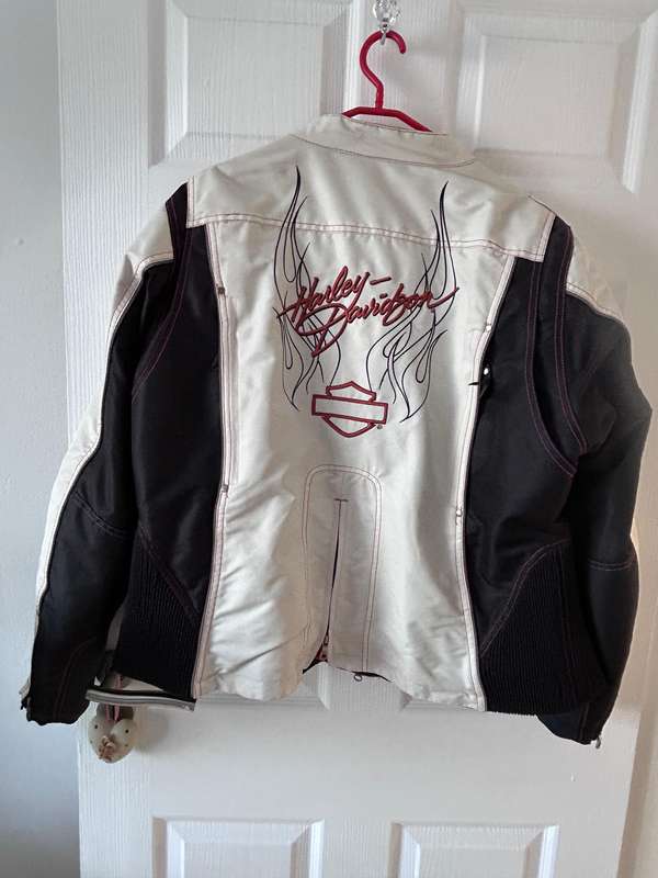 HarleyDavidson motorcycle jacket features a striking white body with black sleeves and red stitching