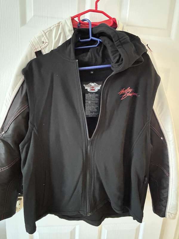 HarleyDavidson motorcycle jacket features a striking white body with black sleeves and red stitching