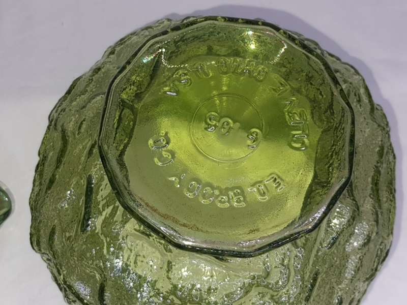 AN ED BRODY  CO, OLIVE GREEN PLANTER OR VASE WITH A OLIVE GREEN BASE PLATE