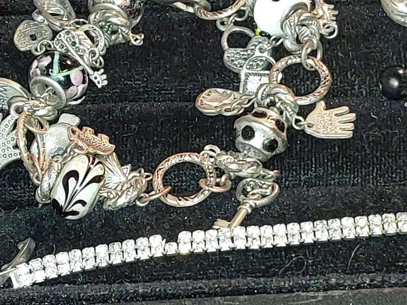 A COLLECTION OF VINTAGE COSTUME BRACELETS AND BANGLES