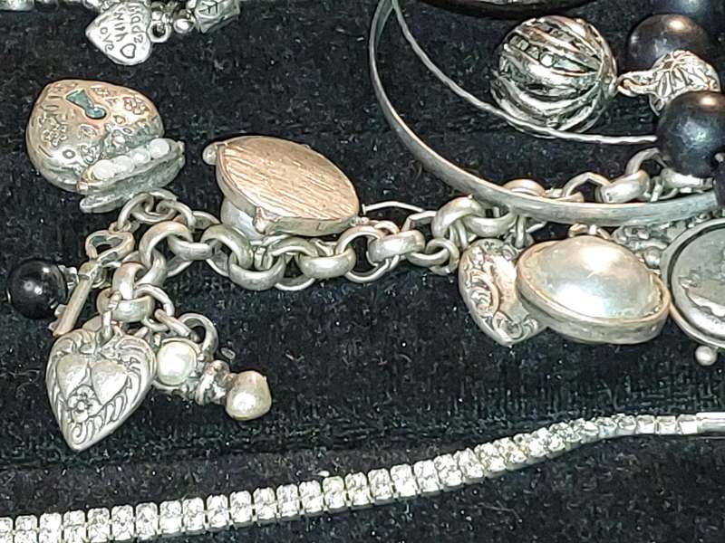 A COLLECTION OF VINTAGE COSTUME BRACELETS AND BANGLES