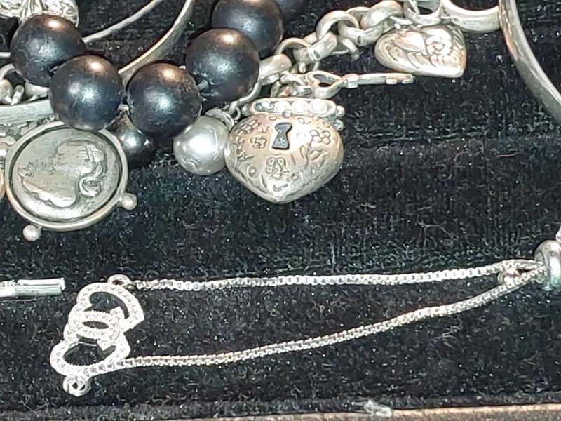 A COLLECTION OF VINTAGE COSTUME BRACELETS AND BANGLES