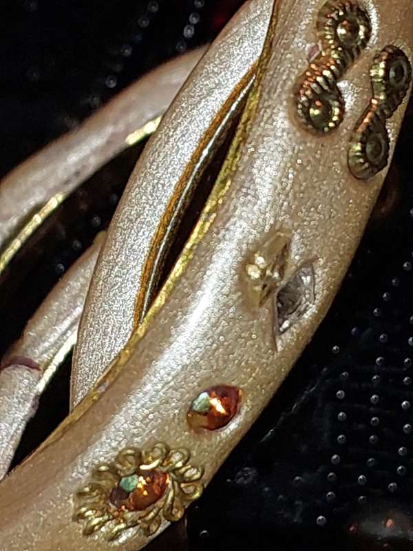 A COLLECTION OF VINTAGE COSTUME BRACELETS AND BANGLES