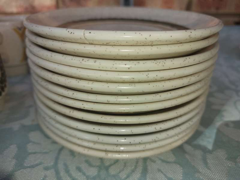 A VINTAGE STONEWARE SUNFLOWER DESIGN 24-PIECE TEACUP AND SAUCER SET