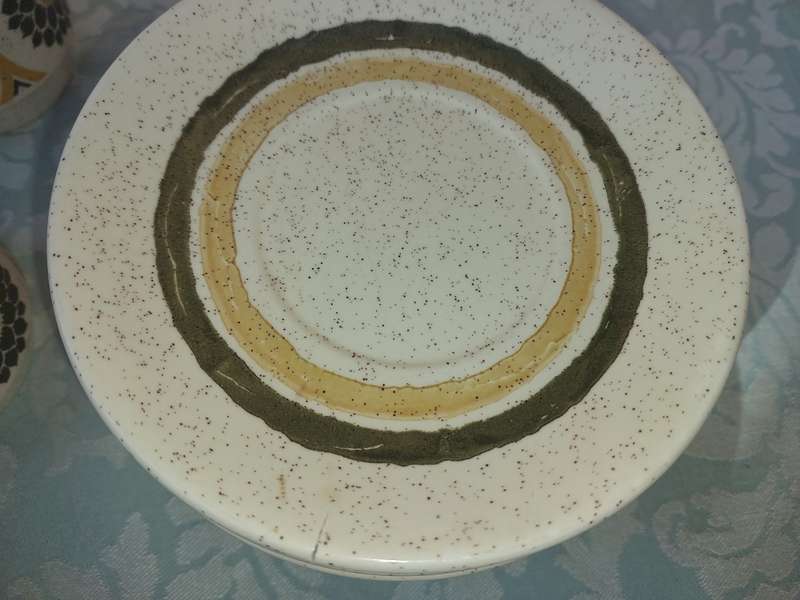 A VINTAGE STONEWARE SUNFLOWER DESIGN 24-PIECE TEACUP AND SAUCER SET