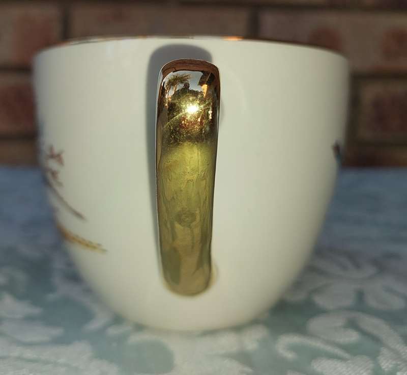 A VINTAGE COLLECTABLE CROWN DEVON FIELDING  FLYING PHEASANTS TEA CUP AND SAUCER