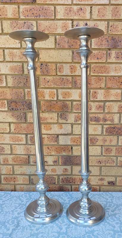 TWO ART DECOR ALUMINUM ALLOY 106 CENTIMETRES IN HEIGHT CANDLE STANDS