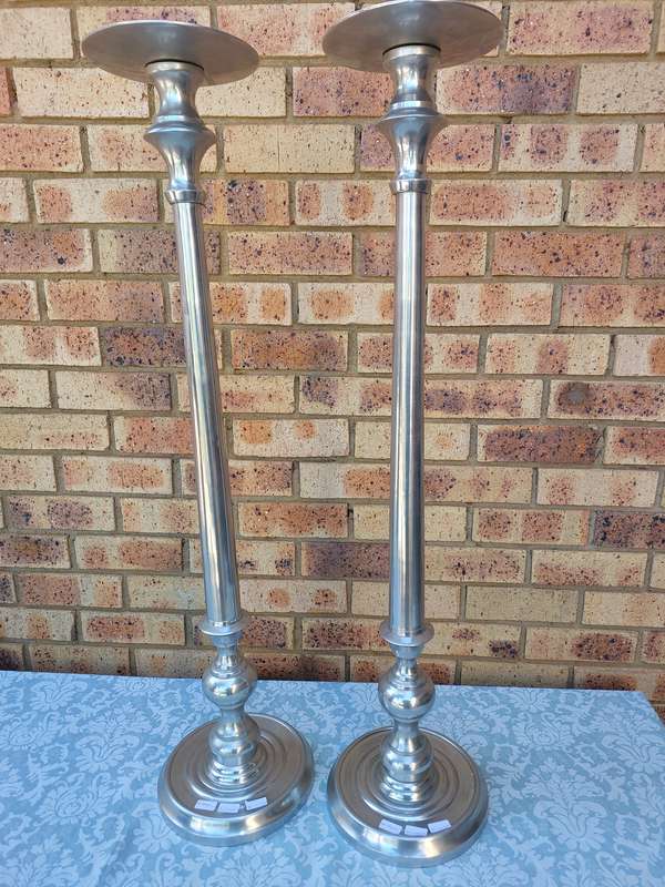 TWO ART DECOR ALUMINUM ALLOY 106 CENTIMETRES IN HEIGHT CANDLE STANDS