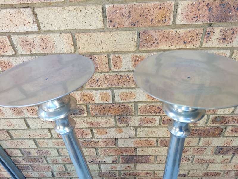 TWO ART DECOR ALUMINUM ALLOY 106 CENTIMETRES IN HEIGHT CANDLE STANDS