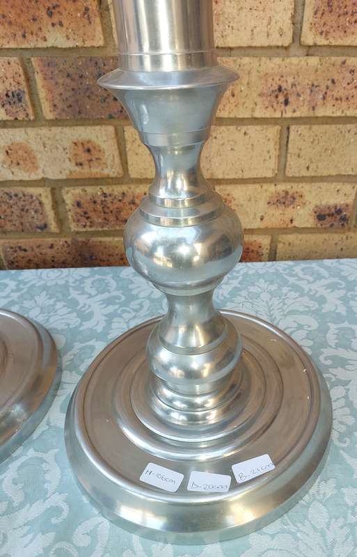 TWO ART DECOR ALUMINUM ALLOY 106 CENTIMETRES IN HEIGHT CANDLE STANDS